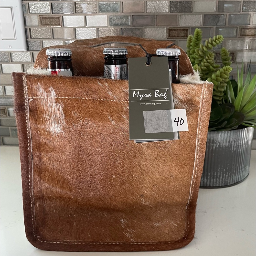 Wine Caddy/Tori holds two. Cowhide